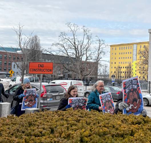 Faith leaders and immigrant advocates march in front of the ICE field office in Manchester on Tuesday to show solidarity with immigrants in response to the Trump administration’s executive orders on deportation.
