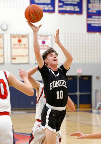 Pioneer’s Brayden Thayer (10) drives to the hoop against Frontier in the first quarter Friday night at Goodnow Gymnasium in South Deerfield.