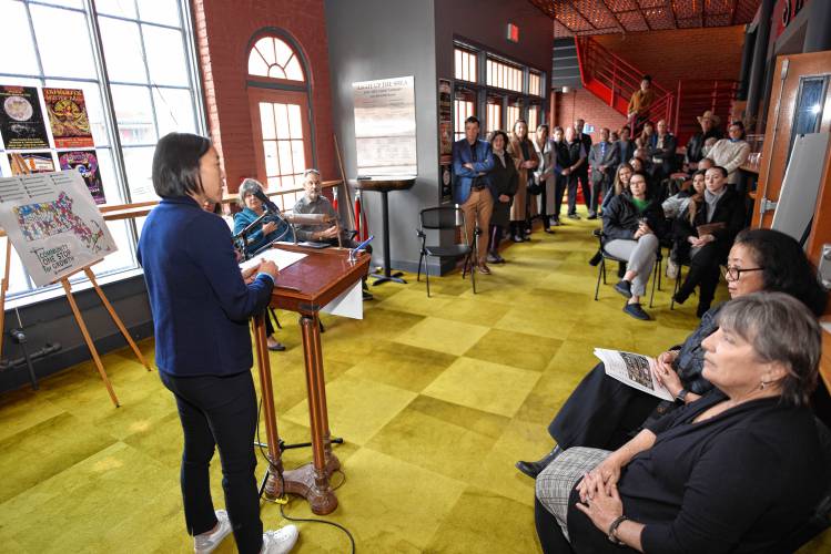 Massachusetts Economic Development Secretary Yvonne Hao, left, speaks at the Community One Stop for Growth awards ceremony at the Shea Theater Arts Center in Turners Falls on Tuesday.