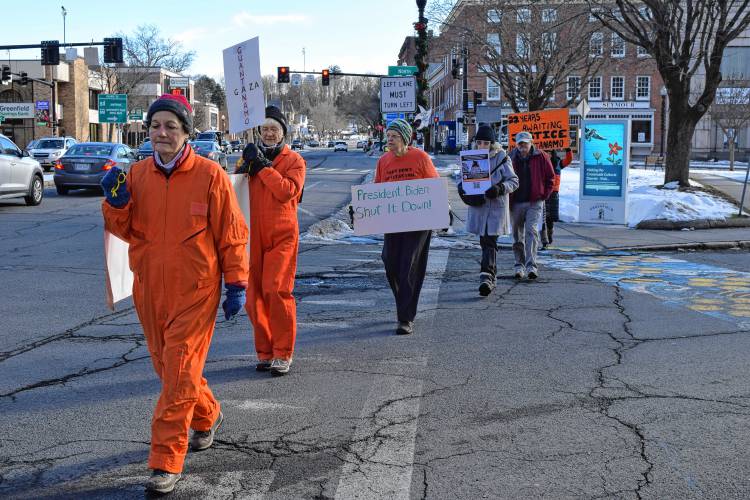 About 10 people gathered in the center of Greenfield on Thursday to protest the continual operation of the Guantanamo Bay detention camp.