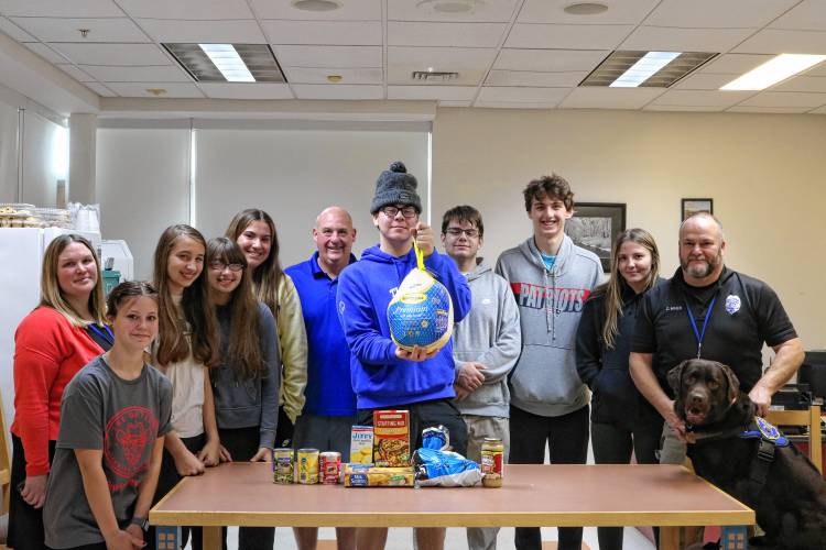 Students and staff at Turners Falls High School packed food last week to be distributed to as many as 22 families ahead of Thanksgiving.