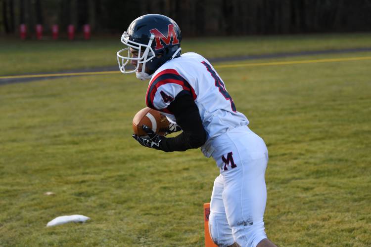 Mahar’s David Vitello makes a catch in the corner of the end zone against Athol at O’Brien Field on Thursday. 