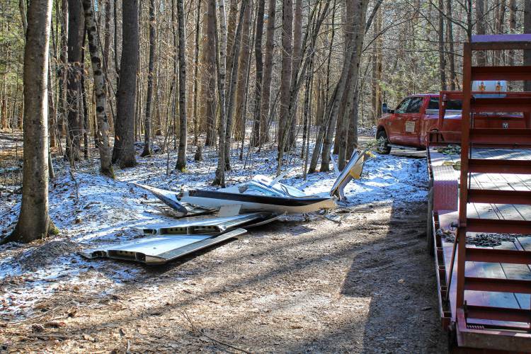 Investigators work Monday on Oak Hill Road in Leyden at the site of a plane crash that killed all three on board on Sunday morning.