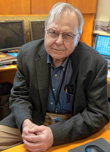 Richard Nathhorst, a member of the Dudleyville Road Committee in Leverett, pictured in his office at the University of Massachusetts Amherst. He would prefer to pave the road.