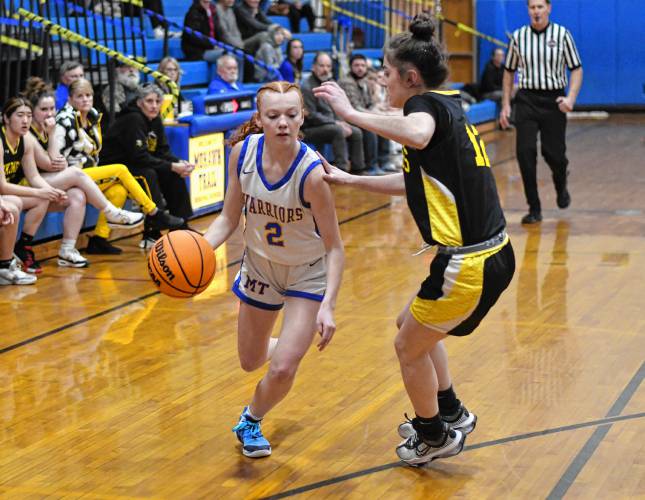 Mohawk Trail’s Natalie Lanoue (2) drives the lane against Smith Voc’s Makayla Tatro during the Warriors’ 46-23 win in Buckland on Thursday night.