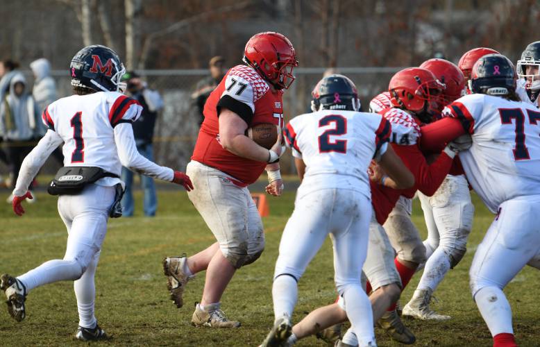 Athol’s Joey Grant (77) scores a two-point conversion against Mahar at O’Brien Field on Thursday. 