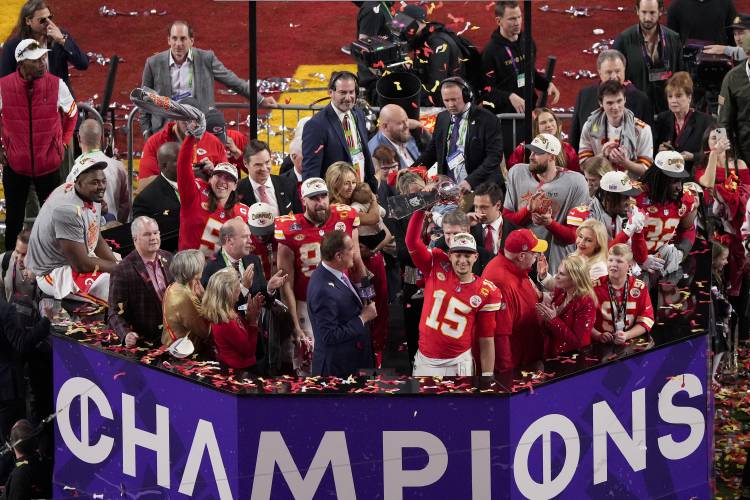 Kansas City Chiefs quarterback Patrick Mahomes (15) lifts the Vince Lombardi Trophy after the team's victory over the San Francisco 49ers in the NFL Super Bowl 58 football game Sunday, Feb. 11, 2024, in Las Vegas. (AP Photo/David J. Phillip)