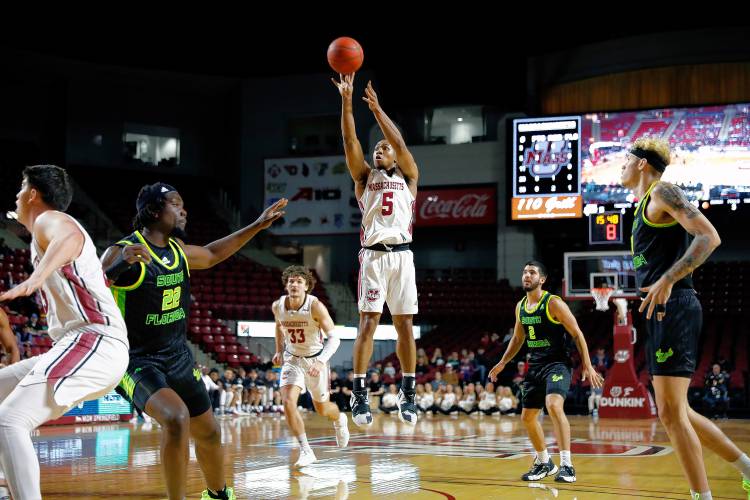 UMass guard Keon Thompson (5) puts up a jumper against South Florida in the first half Saturday at the Mullins Center in Amherst.