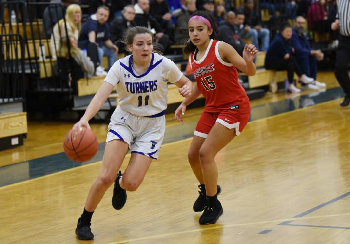 Turners Falls' Taylor Greene (11) dribbles past Pope Francis' Isabella Meadows (15) last season in Turners Falls. The Thunder won’t have a varsity girls basketball program this winter, instead opting to play a JV schedule due to lack of players.