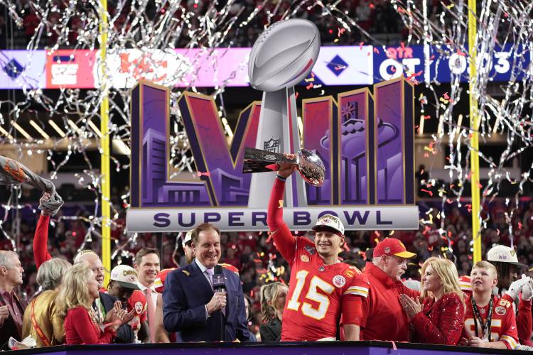 Kansas City Chiefs quarterback Patrick Mahomes (15) holds the Vince Lombardi Trophy after the NFL Super Bowl 58 football game against the San Francisco 49ers on Sunday, Feb. 11, 2024, in Las Vegas. The Chiefs won 25-22. (AP Photo/George Walker IV)