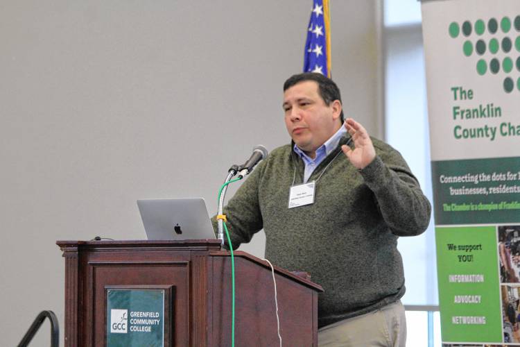 Garden Cinemas co-owner Isaac Mass speaks at the Franklin County Chamber of Commerce’s November breakfast at Greenfield Community College on Friday.