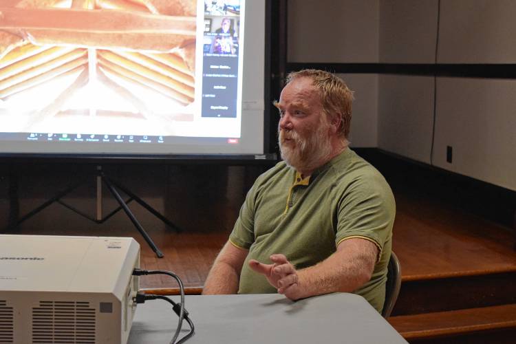Alan Spooner, owner of Cruckfather LLC, speaks at the Woodlands Partnership of Northwest Massachusetts’ board meeting in the Shelburne-Buckland Community Center on Wednesday.