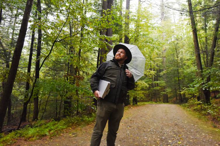 Christian Drake, a Department of Conservation and Recreation park interpreter at the Mohawk Trail State Forest, in a grove of towering white pine trees.