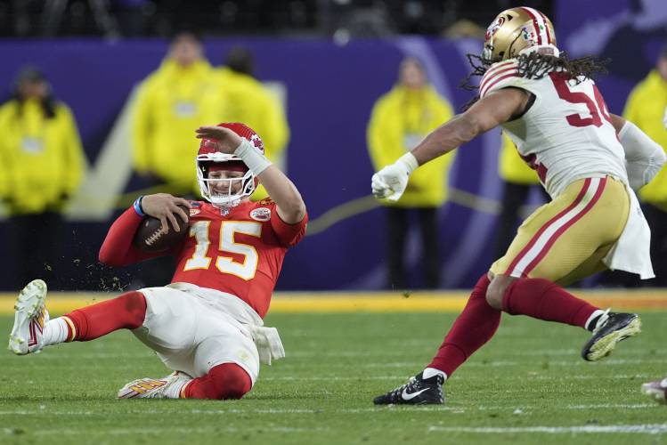 Kansas City Chiefs quarterback Patrick Mahomes (15) slides after a run against the San Francisco 49ers during overtime in the NFL Super Bowl 58 football game Sunday, Feb. 11, 2024, in Las Vegas. (AP Photo/George Walker IV)