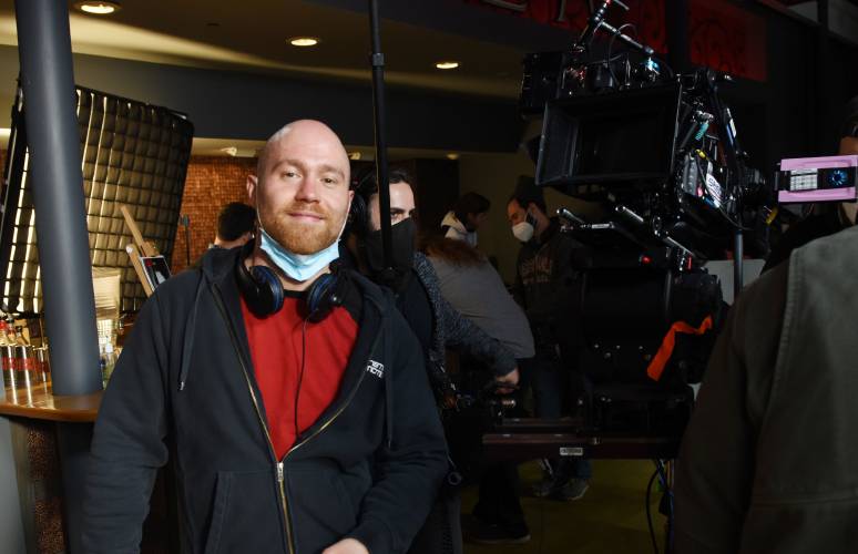 Director/Producer Julian Lowenthal appears on the set for the movie “Money Game,” which was shot at the Shea Theater in Turners Falls. 