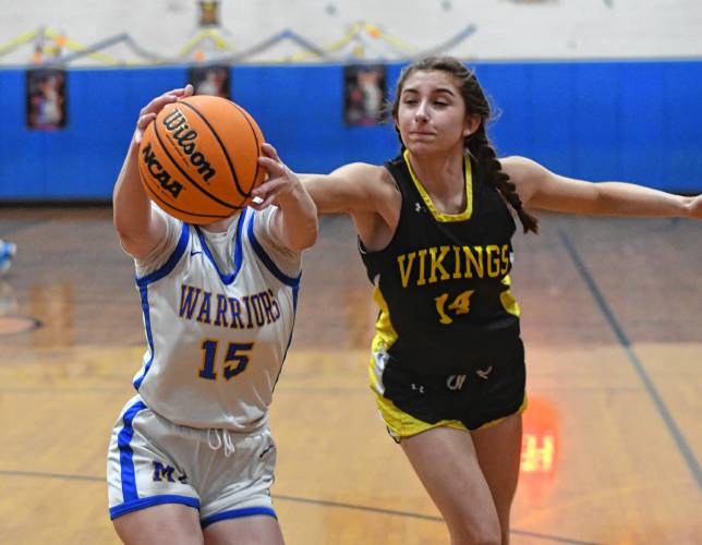 Mohawk Trail’s Rachel Pease, left, and Smith Voc’s Sofia Zina vie for a rebound in Buckland Thursday night.