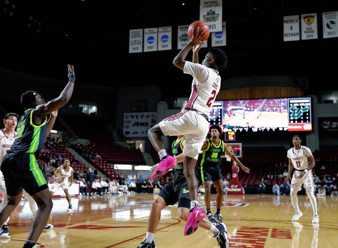 UMass guard Jaylen Curry (2) takes a shot against South Florida in the first half Saturday at the Mullins Center in Amherst.