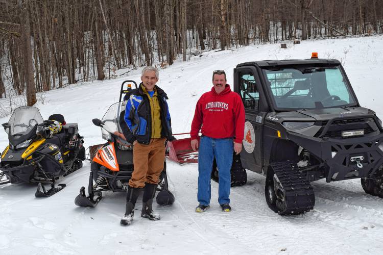 Snowmobile Association of Massachusetts Executive Director Jeff Miller, left, and Steven Howland, president of the Buckland Riders Snow Mobile Club.