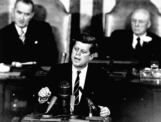 President John F. Kennedy in his historic message to a joint session of Congress on May 25, 1961, declared “I believe this nation should commit itself to achieving the goal, before this decade is out, of landing a man on the Moon and returning him safely to the Earth.” Kennedy was assassinated 60 years ago, on Nov. 22, 1963. Shown in the background of this file photo are, left, Vice President Lyndon B. Johnson, who succeeded Kennedy as president, and House Speaker Sam T. Rayburn.