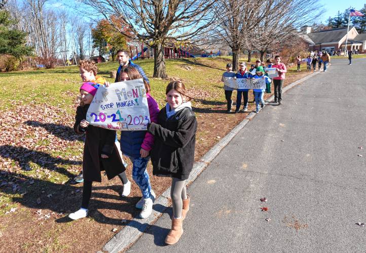 Students and faculty at Conway Grammar School participate in a mini Monte’s March on Monday.