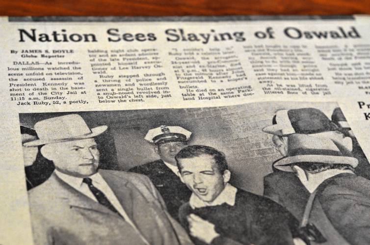 The Nov. 25, 1963, edition of The Boston Globe included the now-famous photo of Jack Ruby killing Lee Harvey Oswald in retaliation for assassinating President John F. Kennedy as Dallas Police Detective Jim Leavelle, left, who was escorting Oswald through the basement of Dallas Police headquarters, reacts with horror and shock.