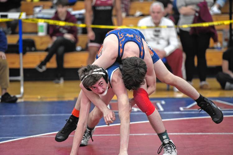 Mahar's Elias Roberts (bottom) competes against Keefe Tech's Jon Arena at the MIAA Div. 3 Central Mass. Championship at Ashland High School on Saturday. 